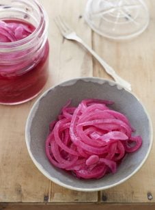 bowl and jar of pickled red onions