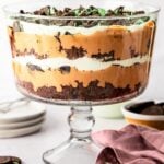 Chocolate mint trile in trifle dish with chocolate mint cookies nearby