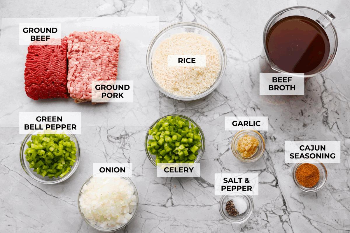 Overhead shot of labeled dirty rice ingredients. 