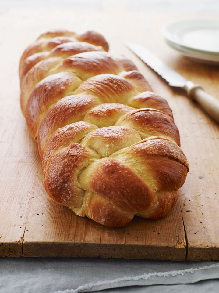 Challah on a wooden surface.