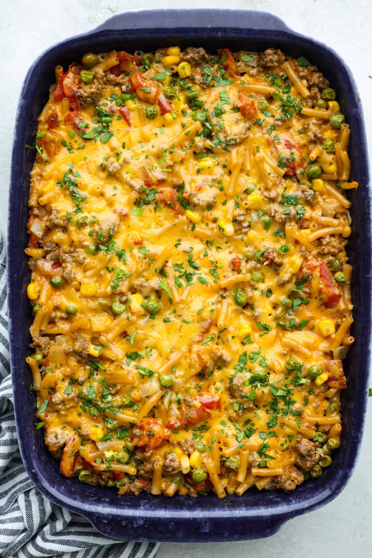 Overhead shot of baked and ready to eat shipwreck casserole in a baking dish. 