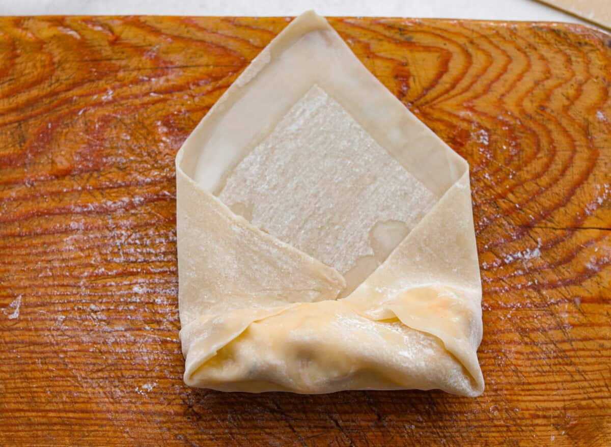 Crack Chicken Egg Rolls wrap savory chicken, crispy bacon, melty cheese, and zesty ranch in a golden, crunchy shell. Easy to make, lighter than deep-fried versions, and perfect for parties or game day! Wrapping the filling like an envelop