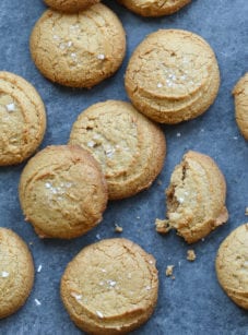 Peanut butter cookies, one of which is broken.