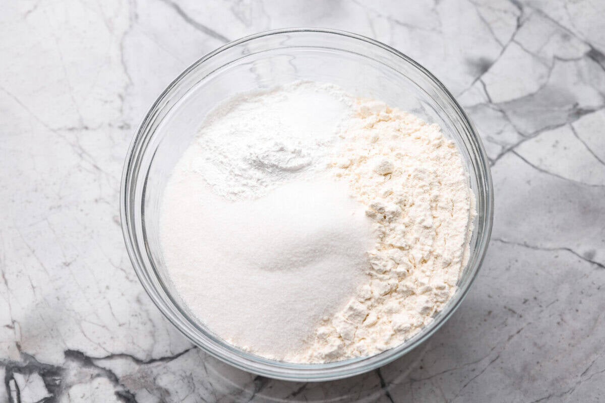 Dry ingredients added to a bowl. 