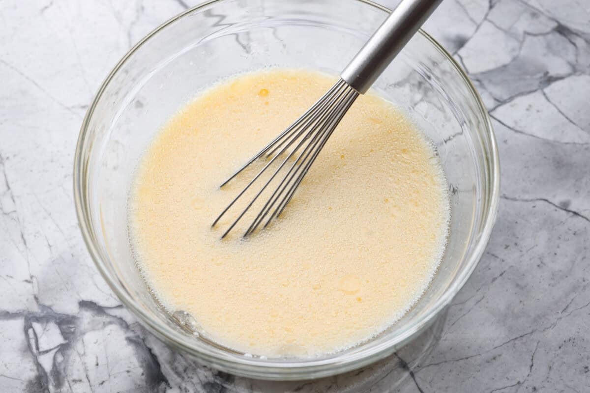 Wet ingredients added to a bowl and whisked together. 