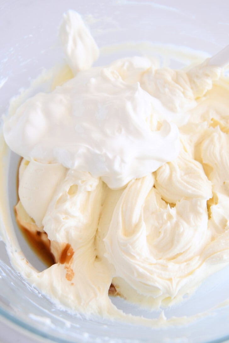 Glass bowl with whipped cream cheese, sour cream and vanilla.