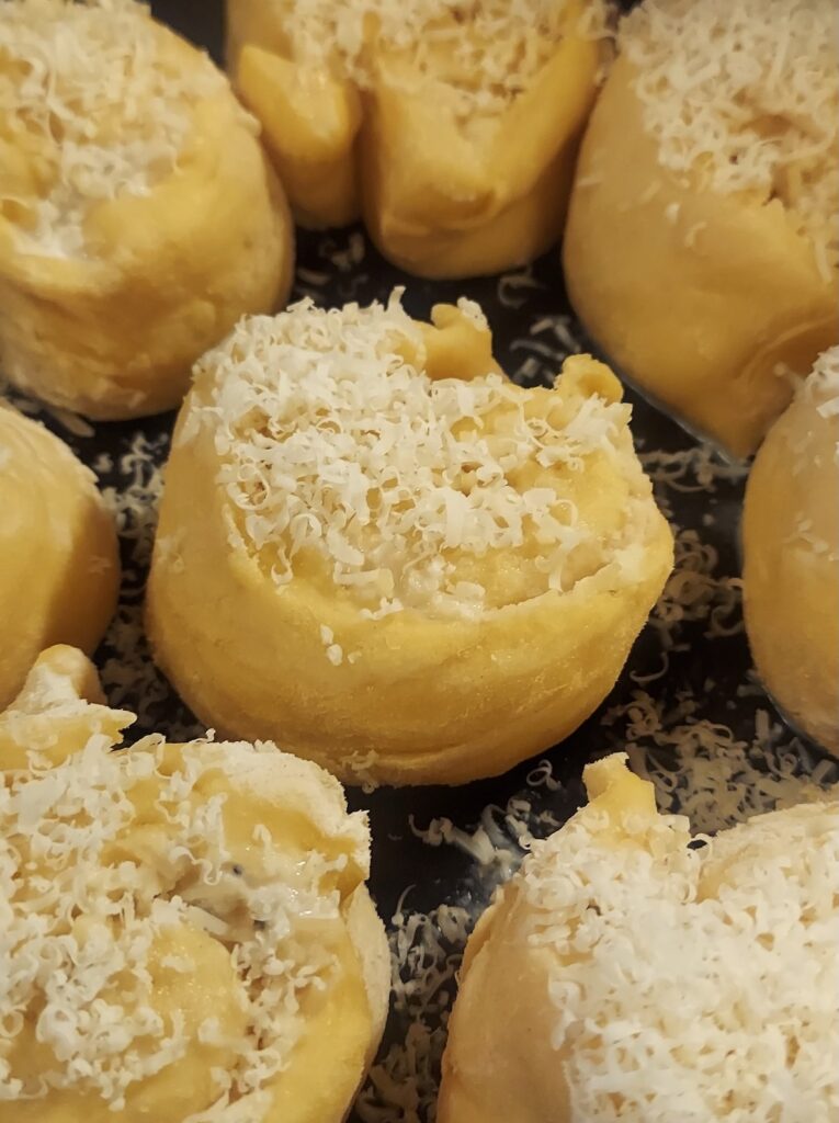 Cheesy cacio e pepe rolls, warm from the stove