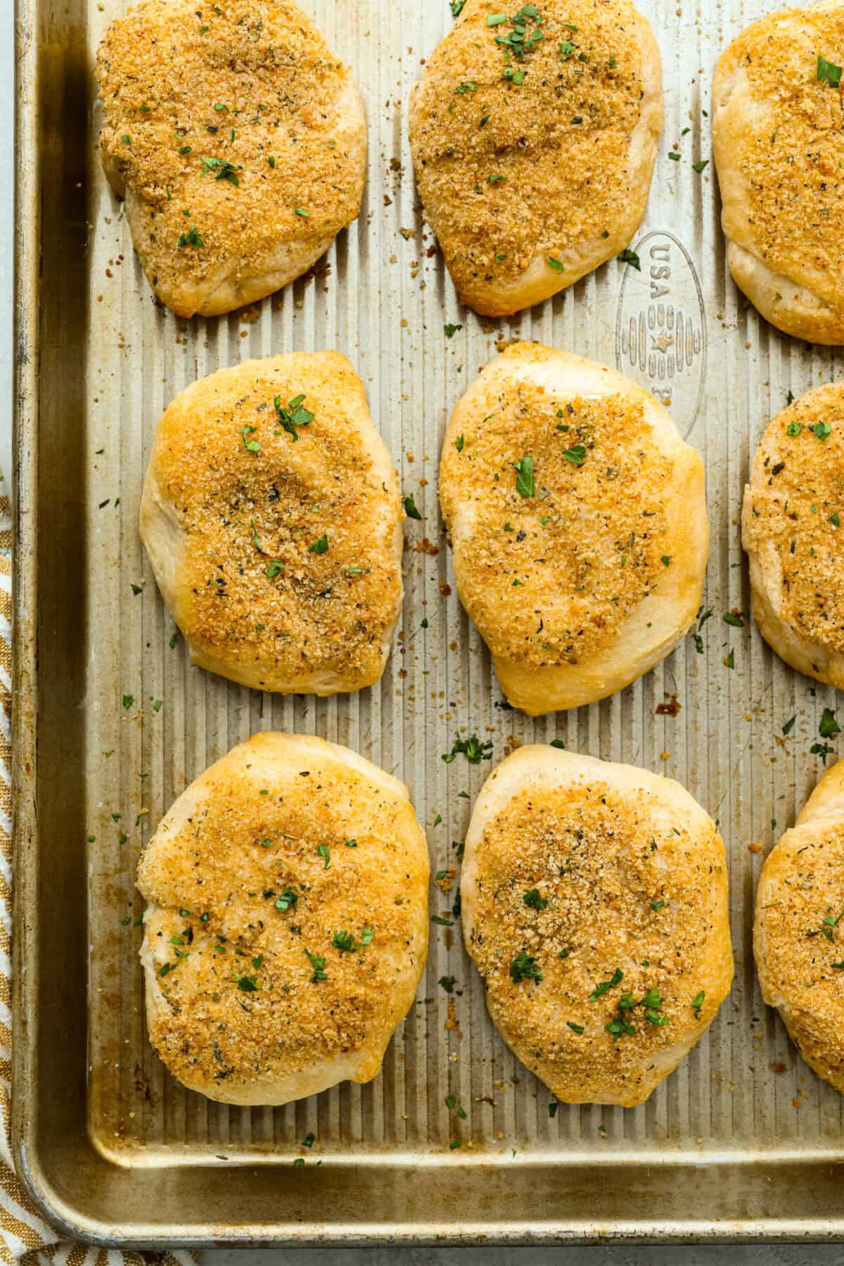 Chicken pillows on the baking sheet all baked and out of the oven. 