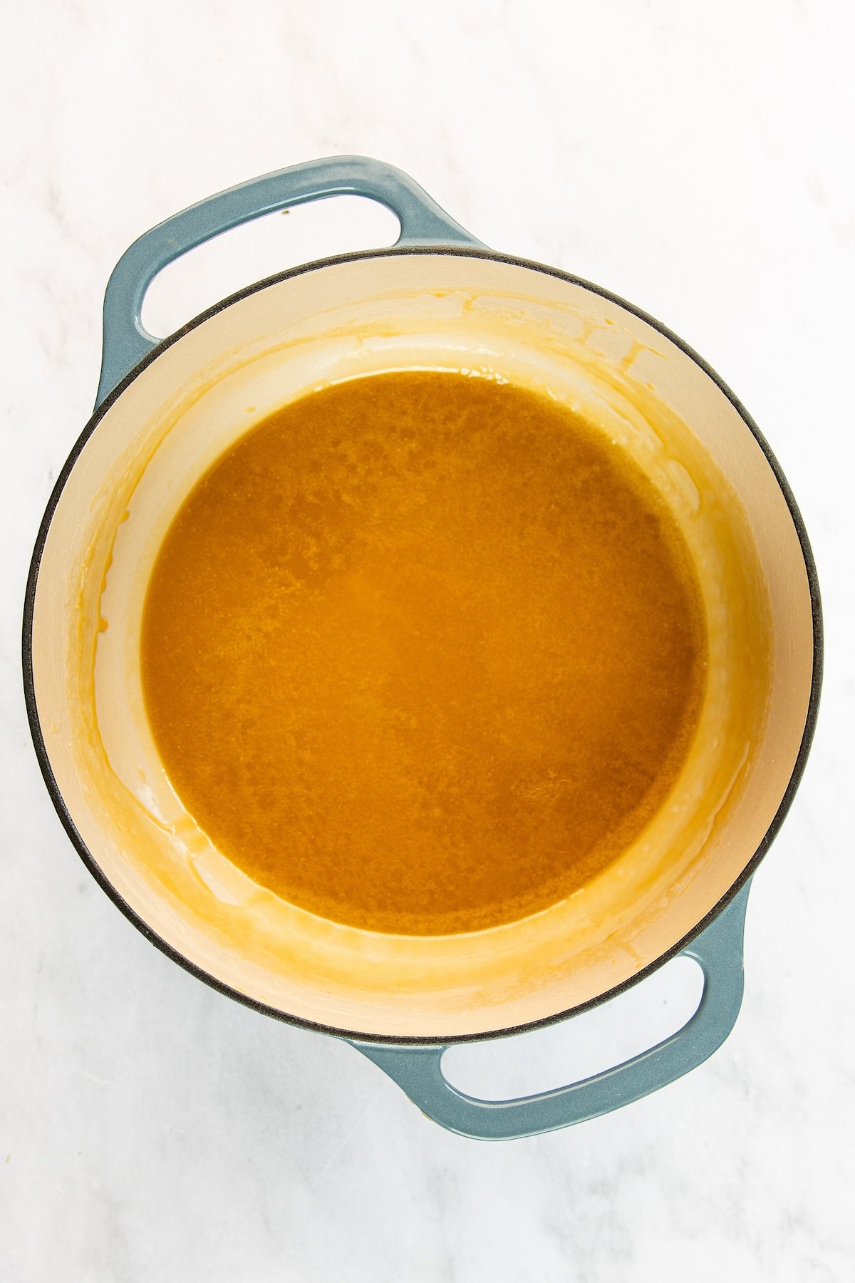 5-qt Dutch oven with cooked sugar, cream, molasses, butter, and salt