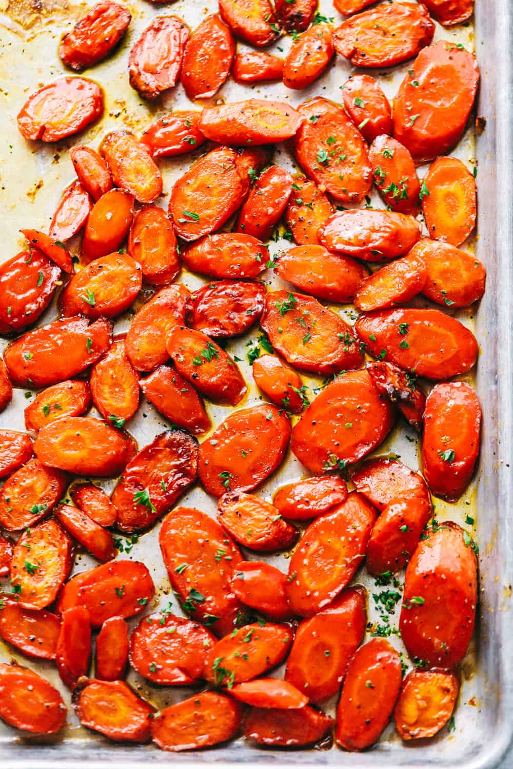 Brown sugar glazed carrots cooked and on a tray.