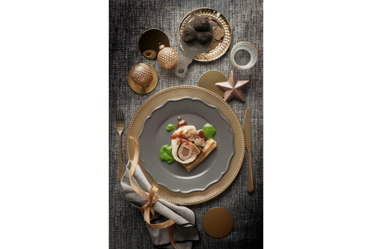Gourmet truffle dish on plate with festive decorations. Urbani Tartufi chef-inspired cuisine. Fine dining.