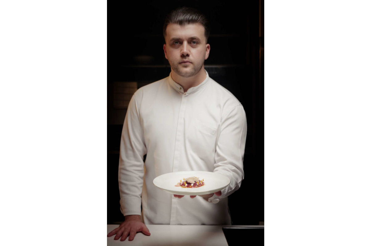 Chef holding truffle dish. Urbani Tartufi culinary creation. Fine dining experience.