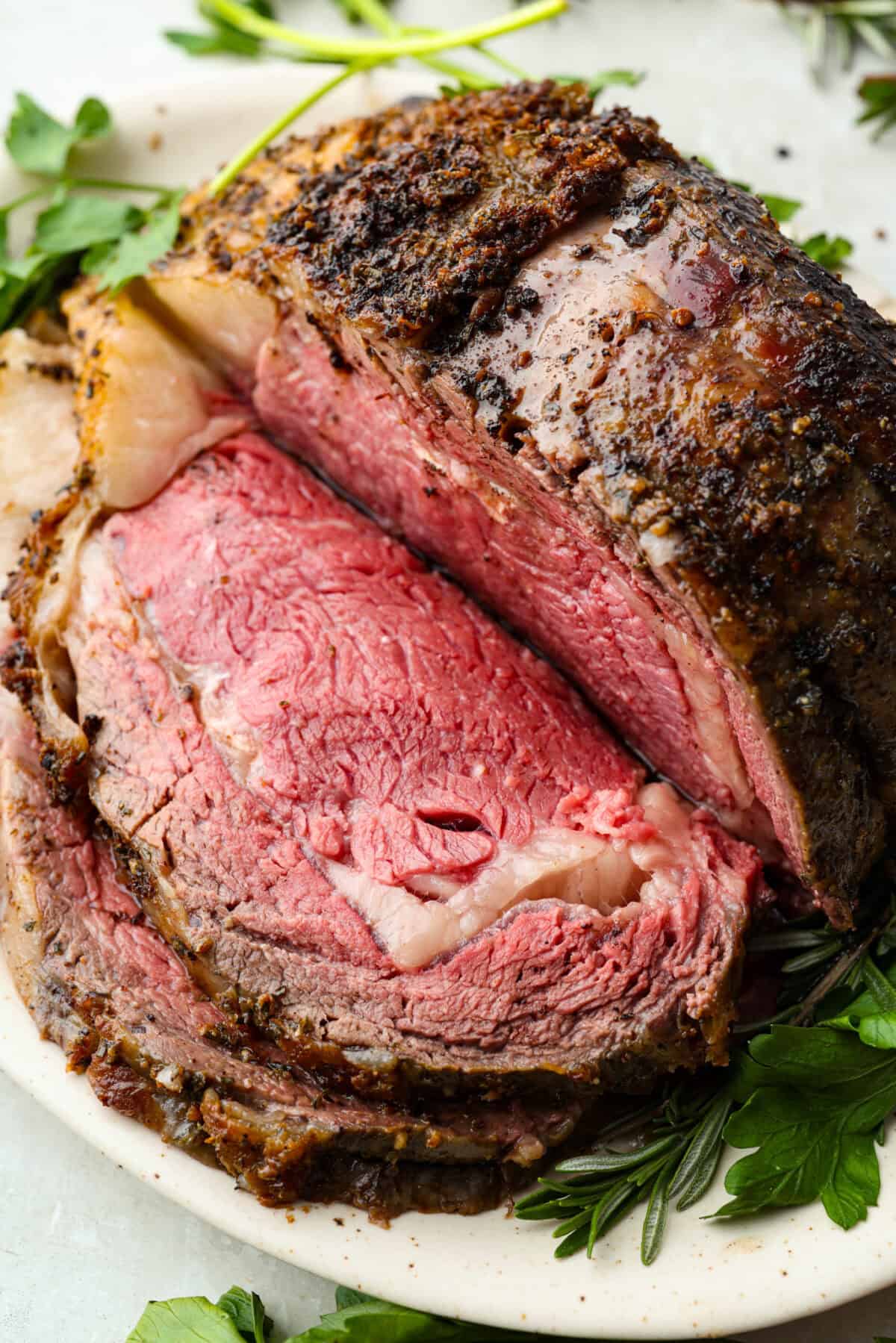 Perfectly cooked medium rare prime rib roast sliced down the middle. 