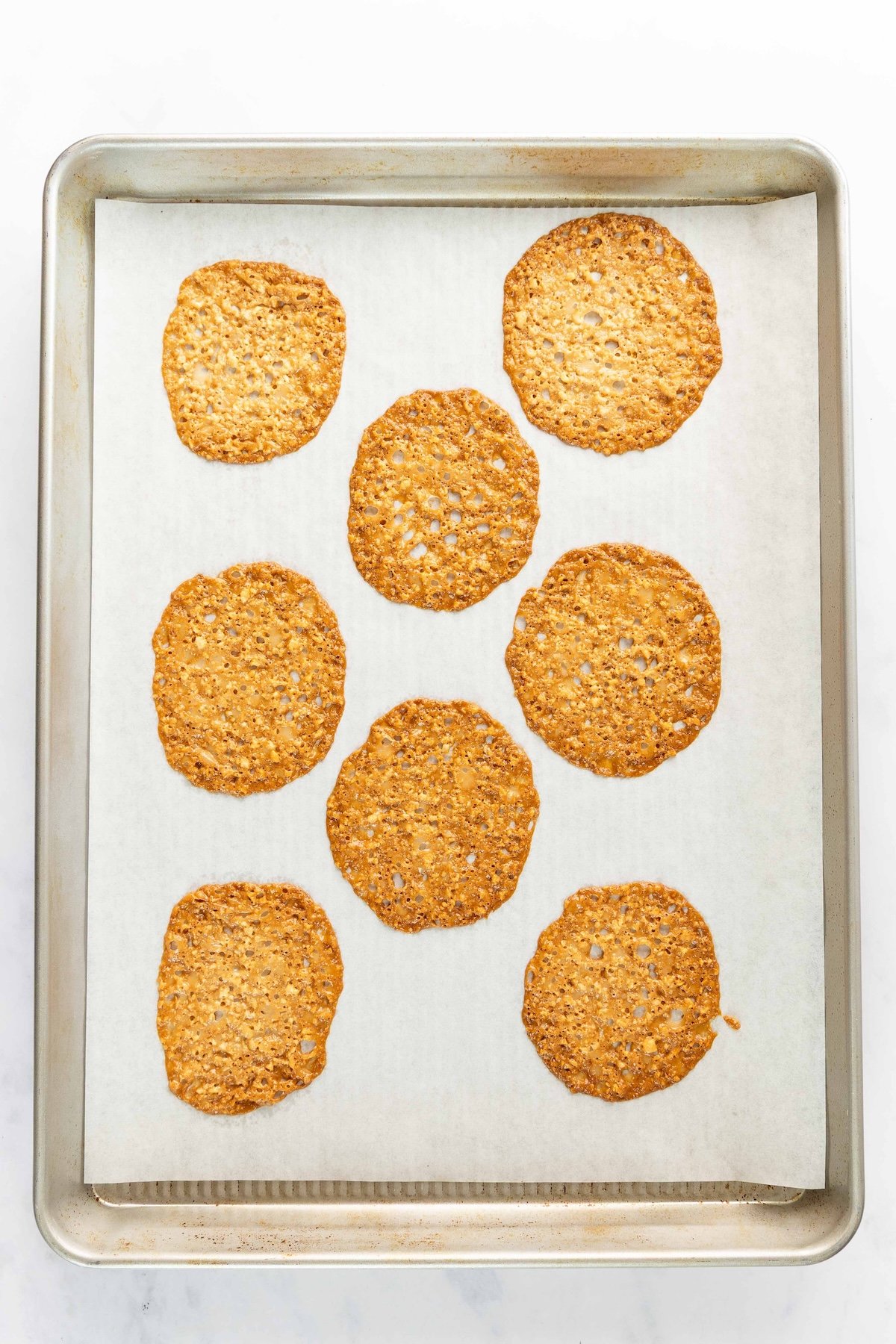 baked cookies on parchment-lined baking sheet