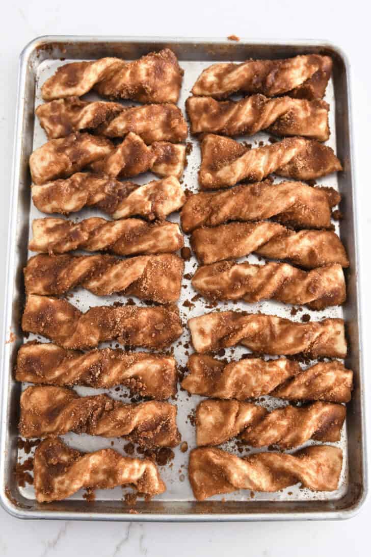 20 cinnamon twists on half sheet pan before rising and baking.