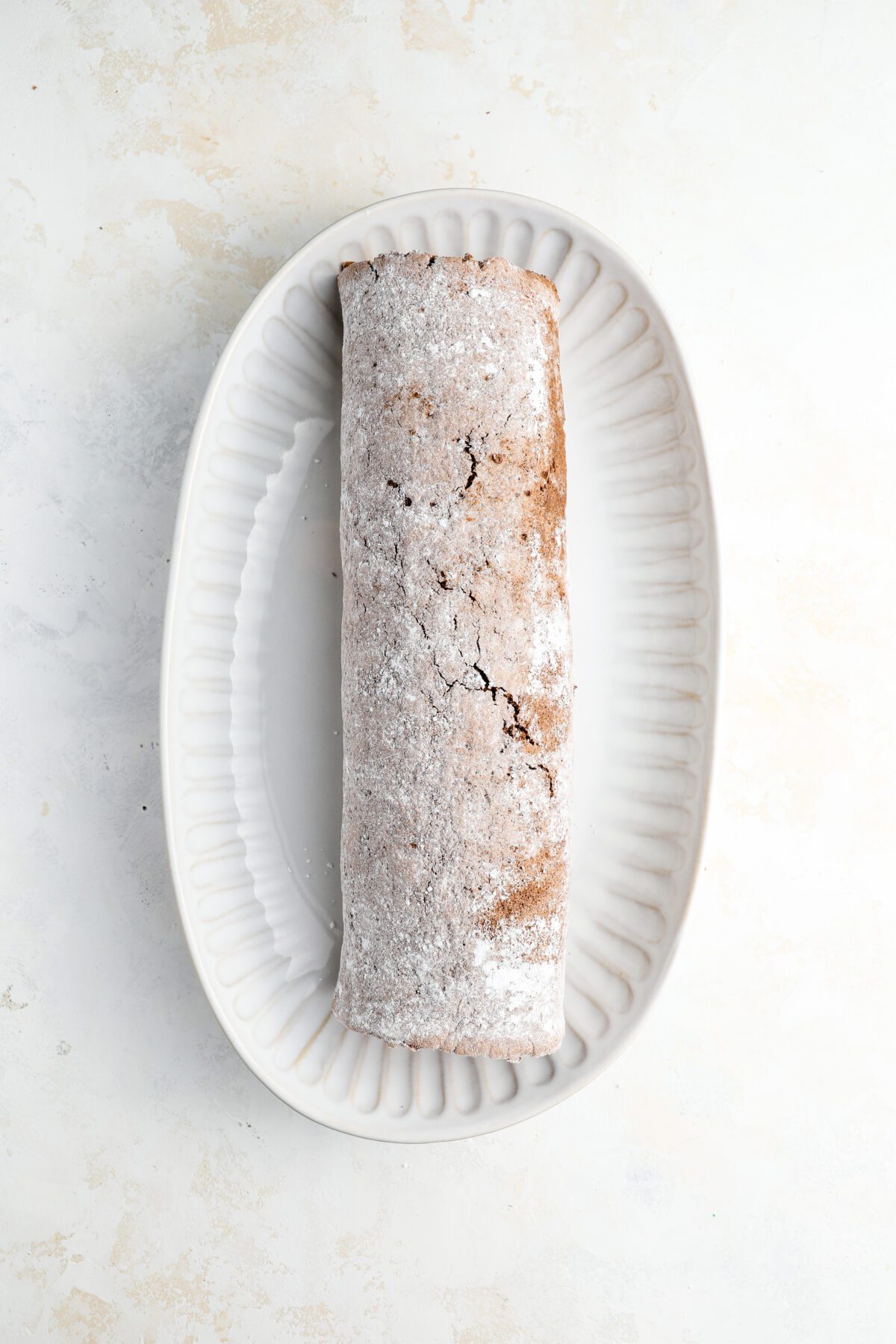 serving platter cake rolled with filling rolled into tight spiral