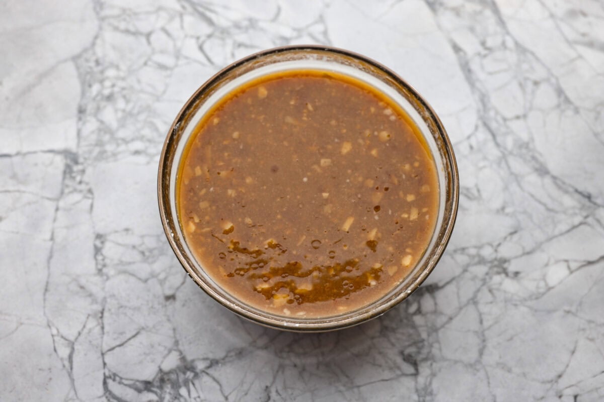 Bowl full of sauce ingredients all mixed together. 