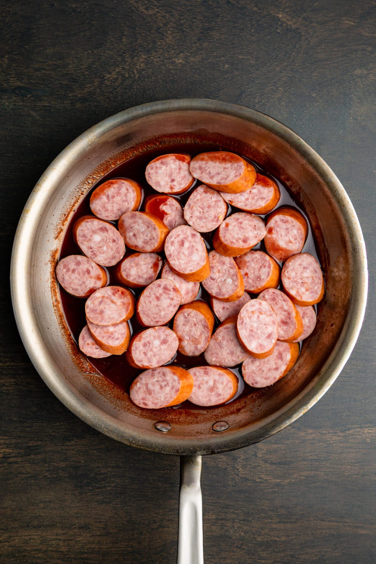 kielbasa and sauce in nonstick skillet