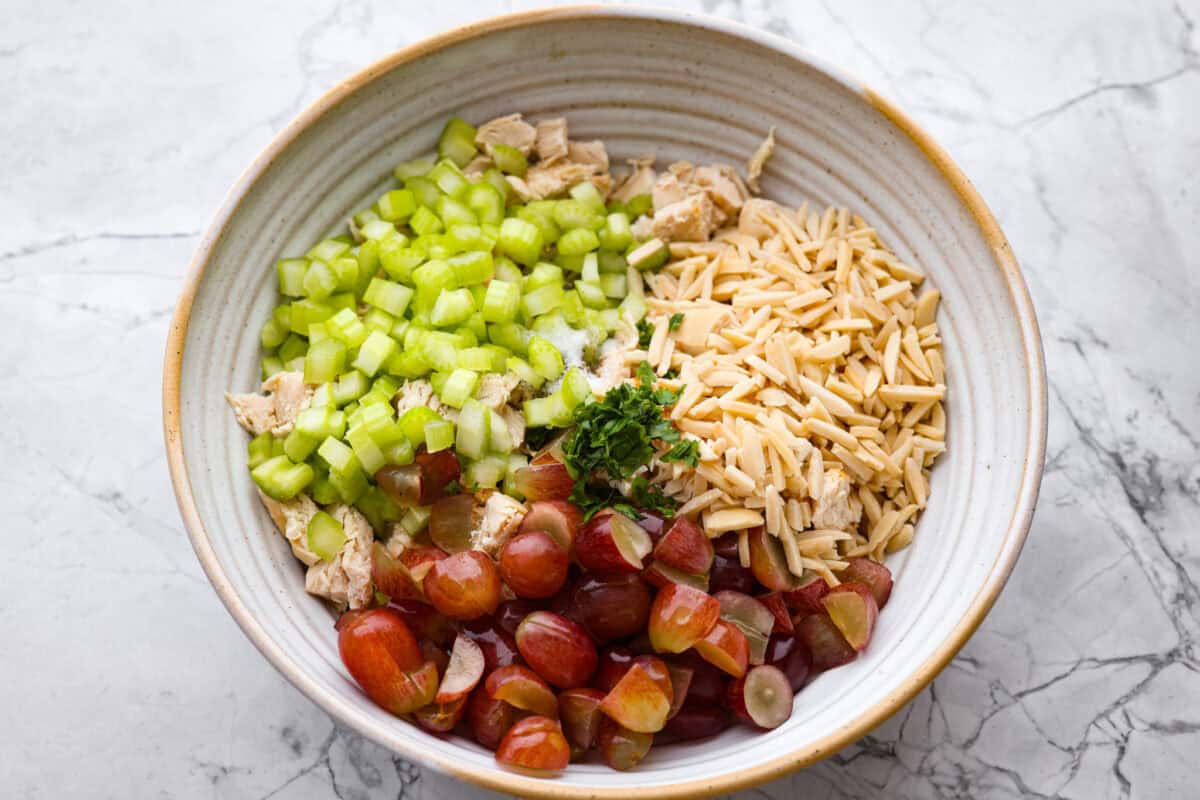 All of the salad ingredients in a large bowl. 
