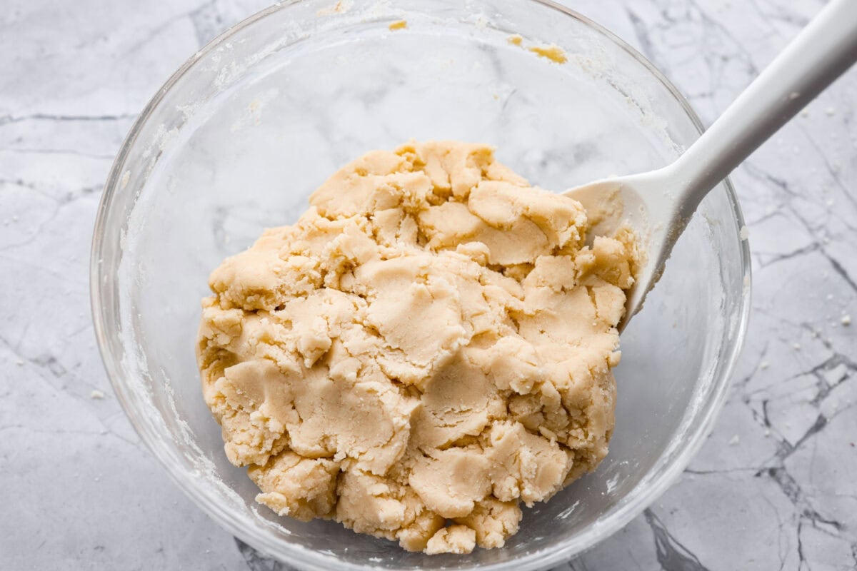 Flour and extract added to the sugar and butter mixture.