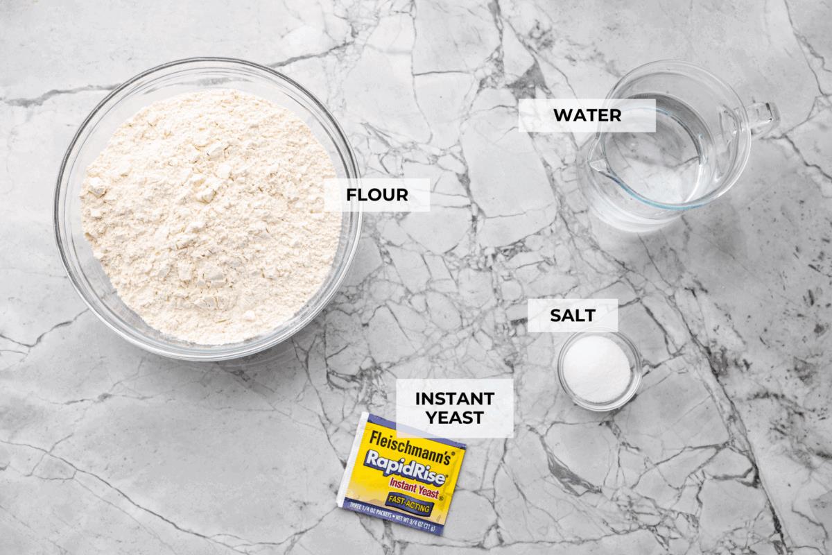 Overhead shot of labeled artisan bread ingredients. 