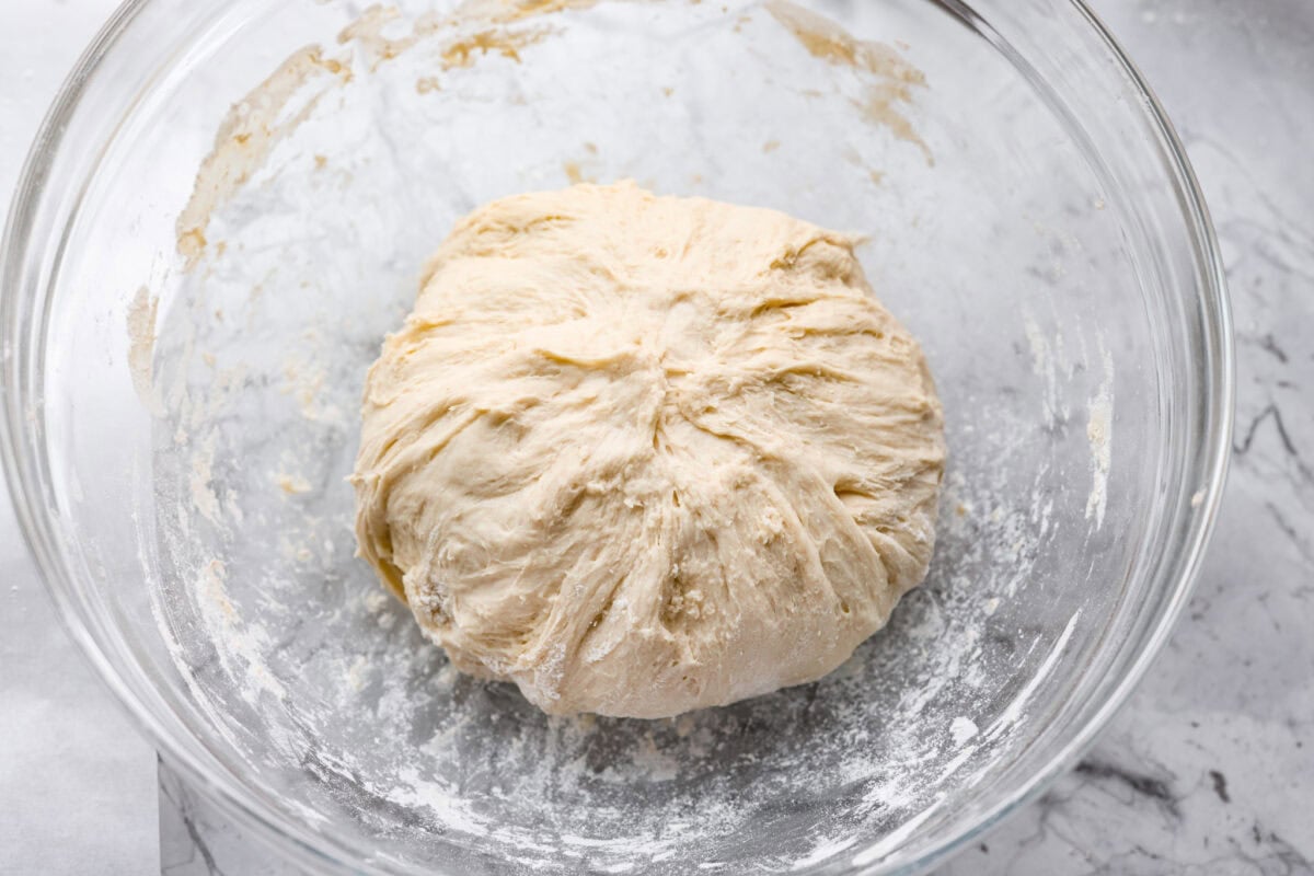 Overhead shot of the dough ball all stretched and folded over back into a ball.