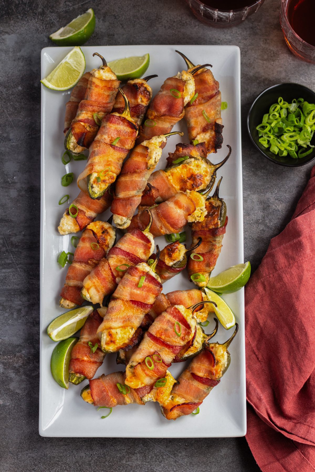 jalapeno poppers on platter with drinks