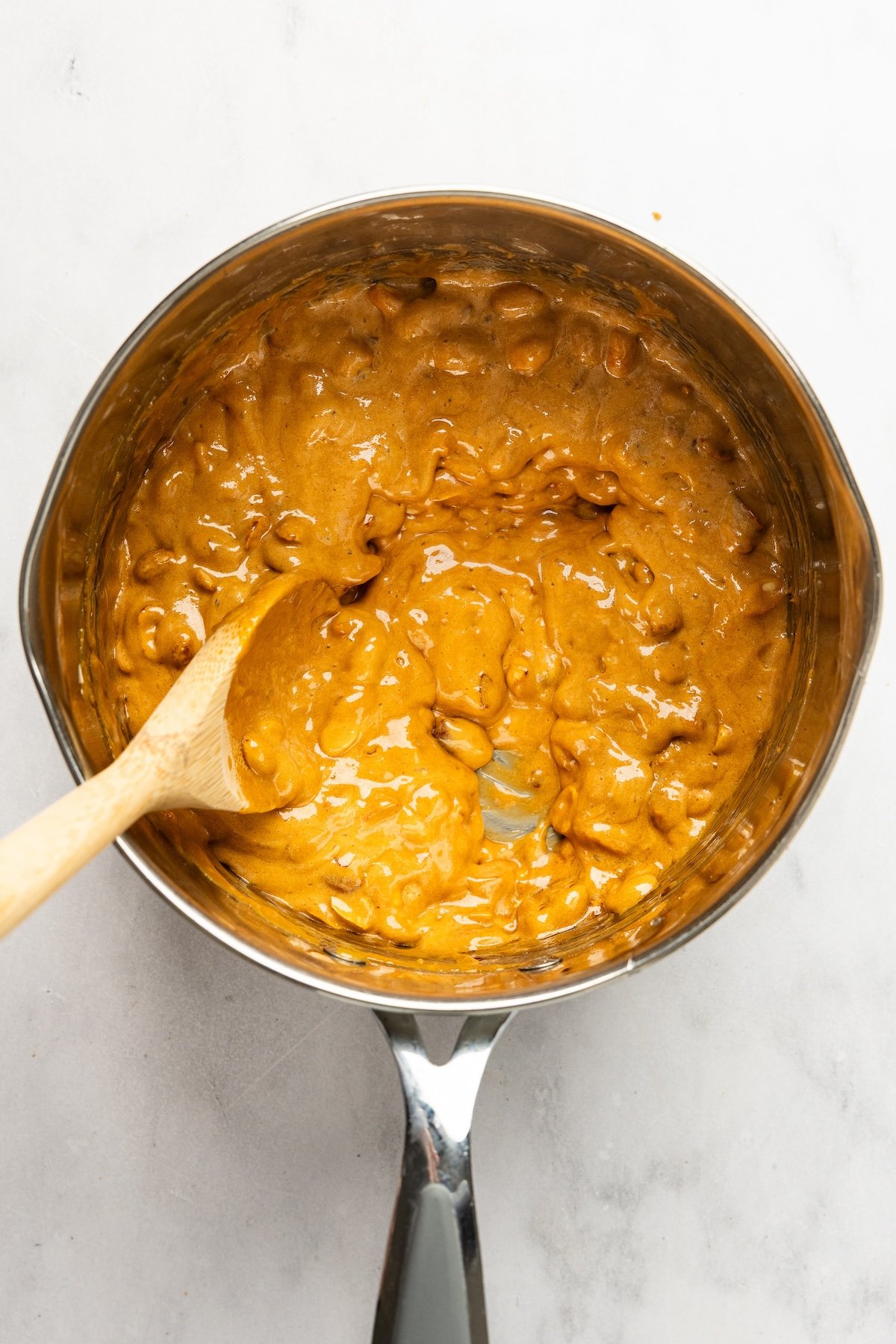medium saucepan with completed peanut brittle