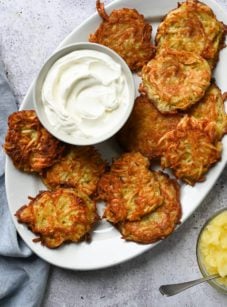 Platter of latkes and sour cream.