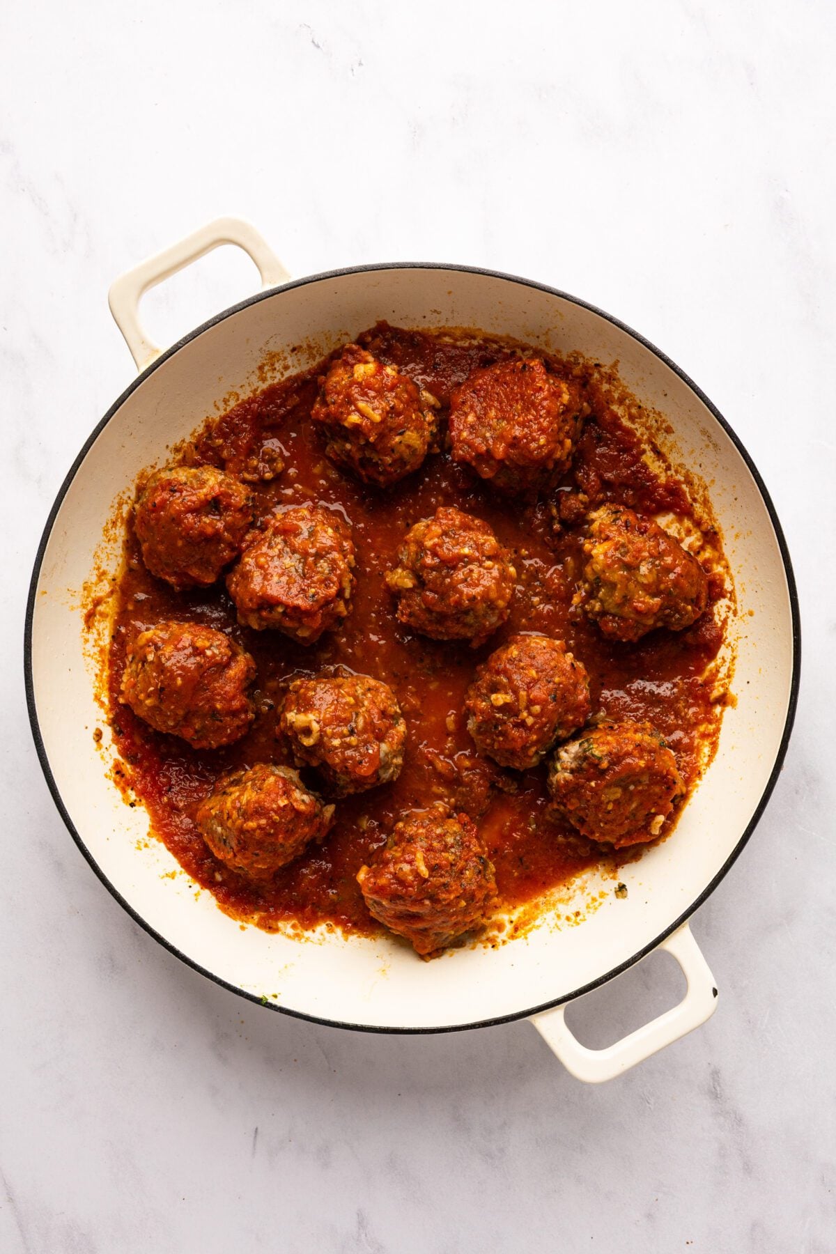 albondigas simmering in the tomato-chipotle sauce