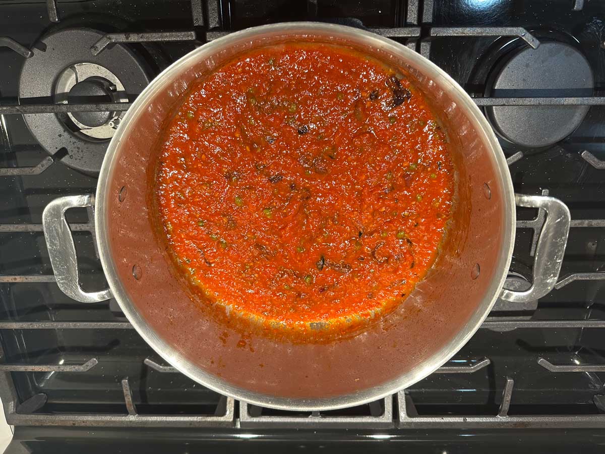 Slow-simmered tomato sauce — cooking increases lycopene bioavailability by 2.5 times compared to raw tomatoes