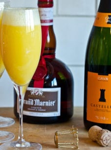Grand mimosas in champagne glasses.