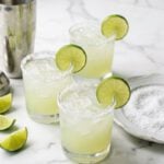 Margarita cocktails garnished with lime slices