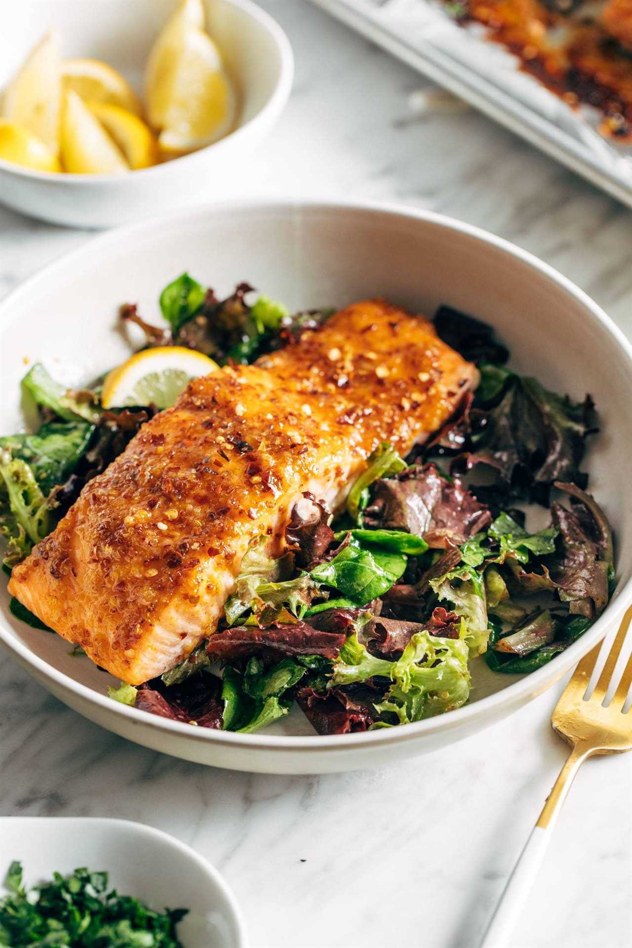Hot honey salmon on a salad mix.
