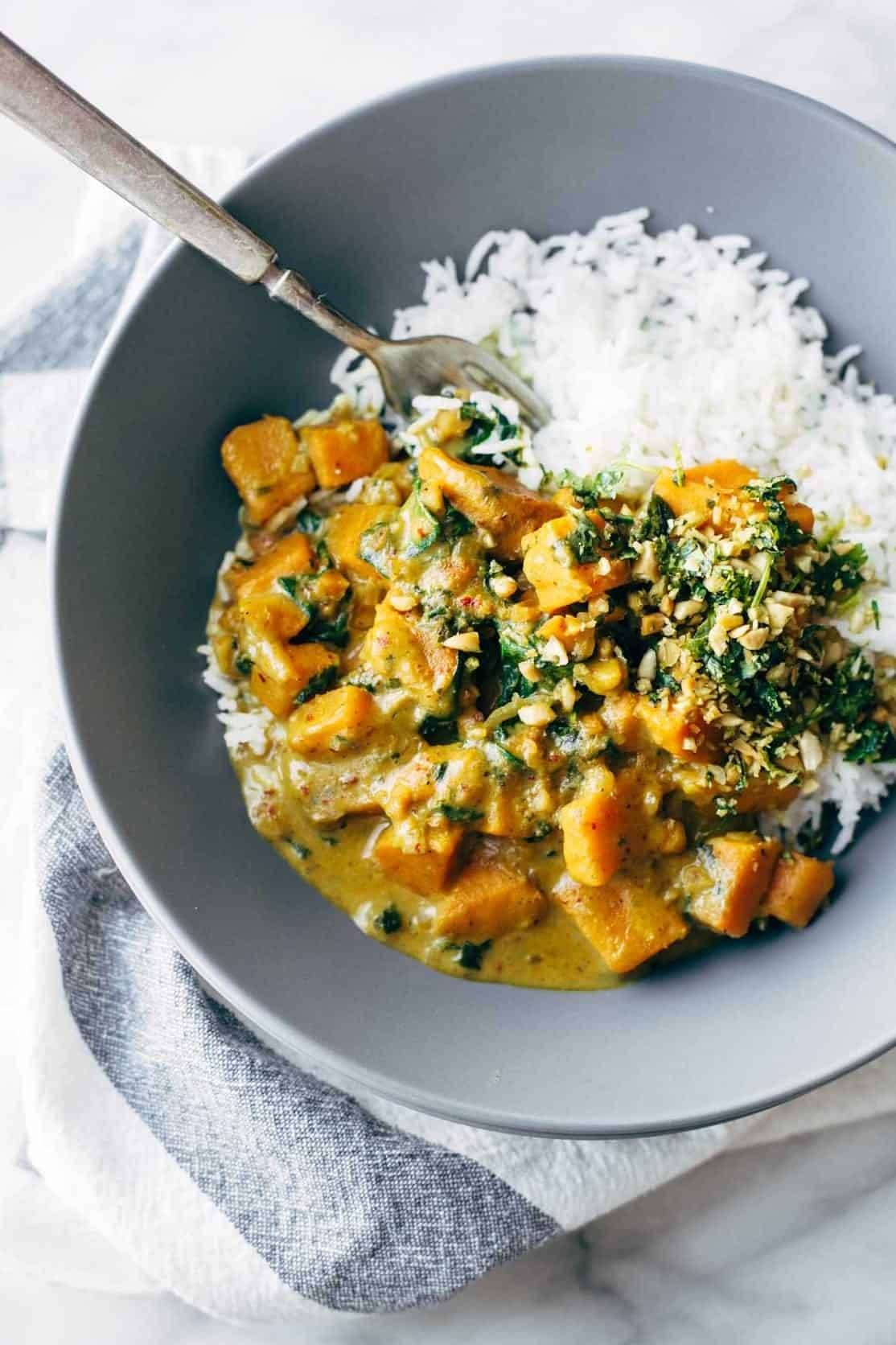 Creamy sweet potato curry in a bowl with rice.