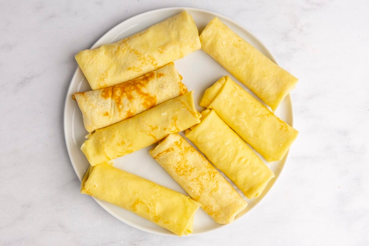 assembled blintzes on white plate