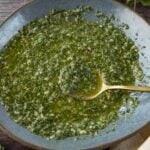 Chimichurri sauce in blue bowl.