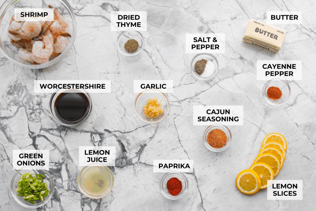 Overhead shot of labeled New Orleans BBQ shrimp ingredients. 