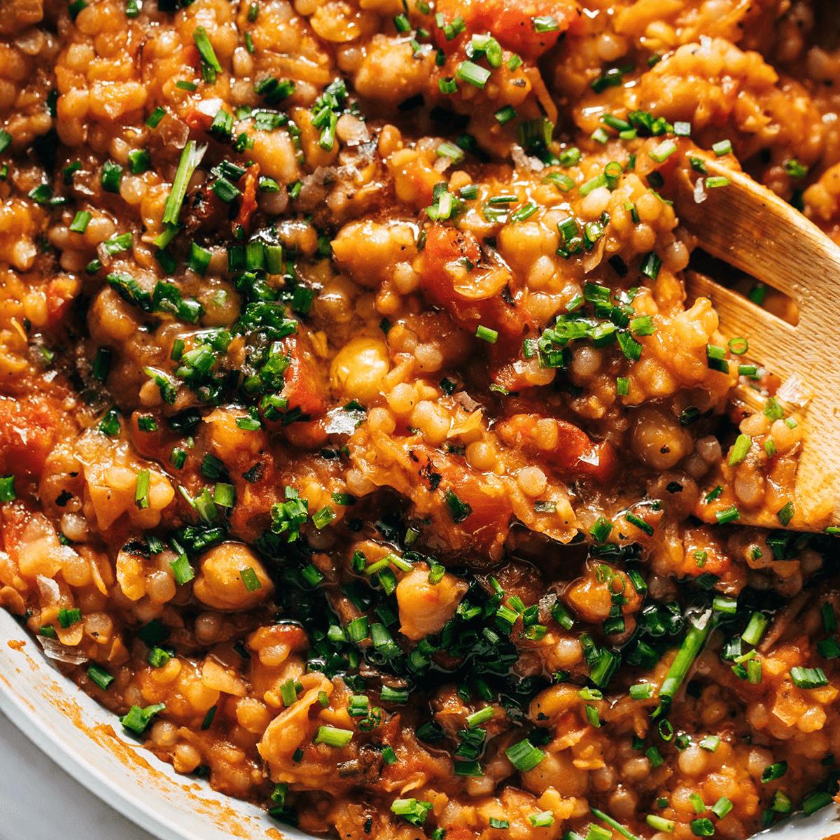 Tomato and pear couscous in a skillet.