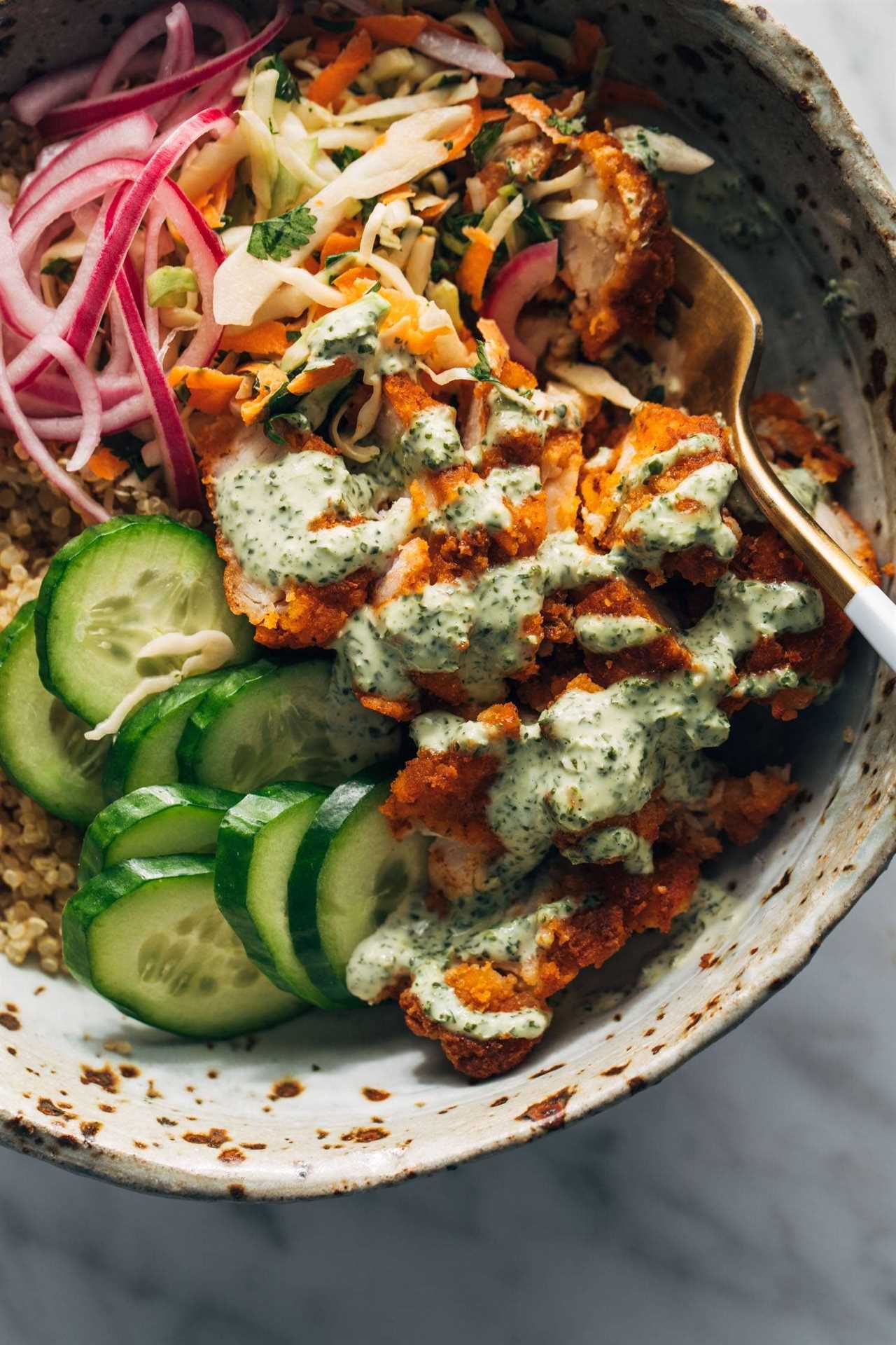Crispy chicken tikka bowls with rice and cucumber.