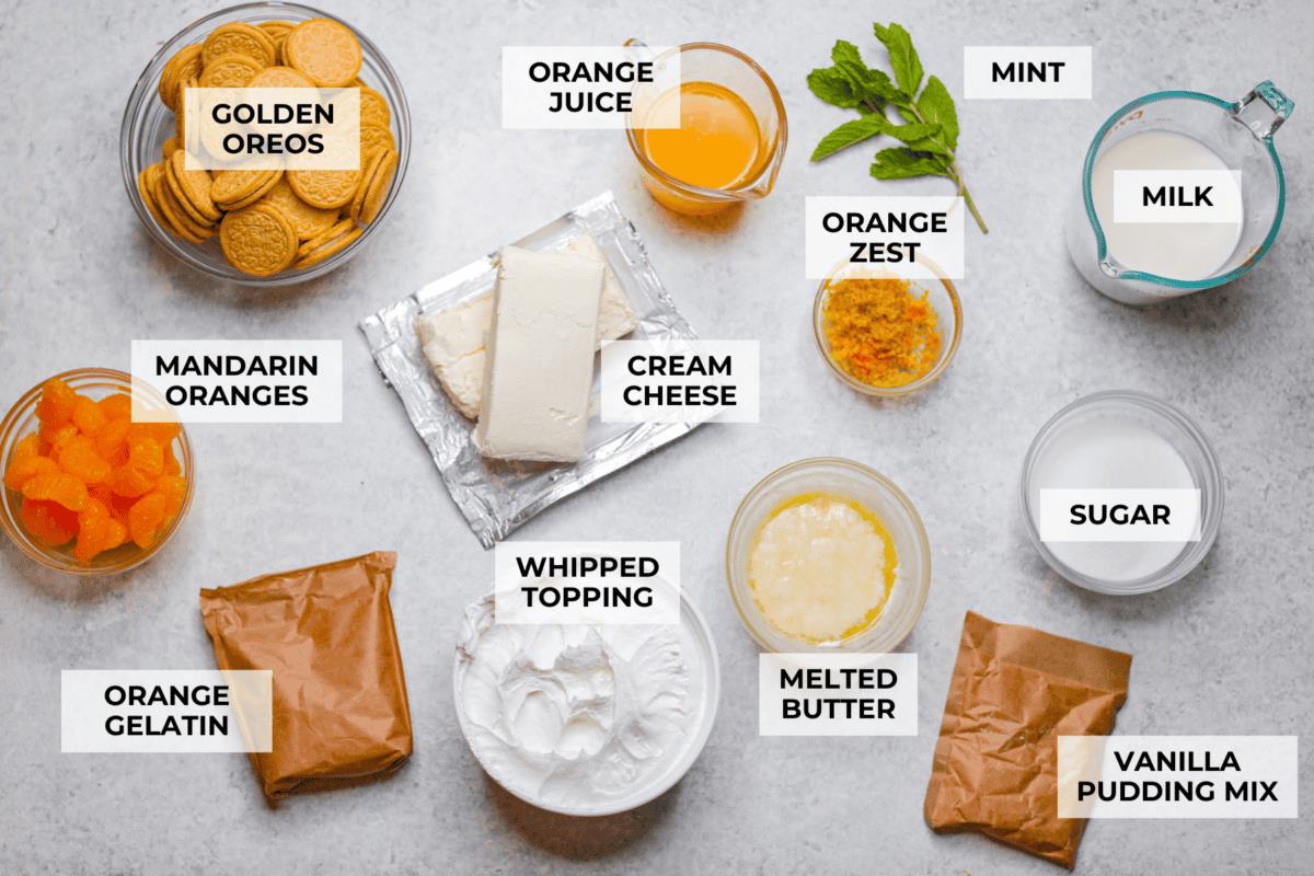 Overhead shot of labeled orange creamsicle lush ingredients. 