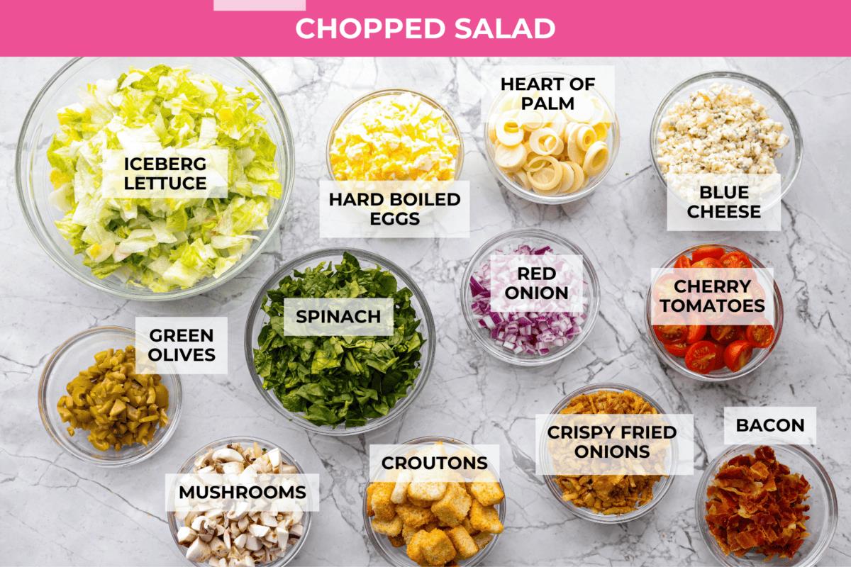 Overhead shot of labeled Ruth's Chris chopped salad ingredients. 