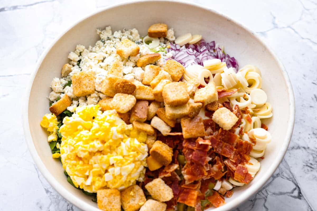 Bowl with all of the different ingredients for the salad.