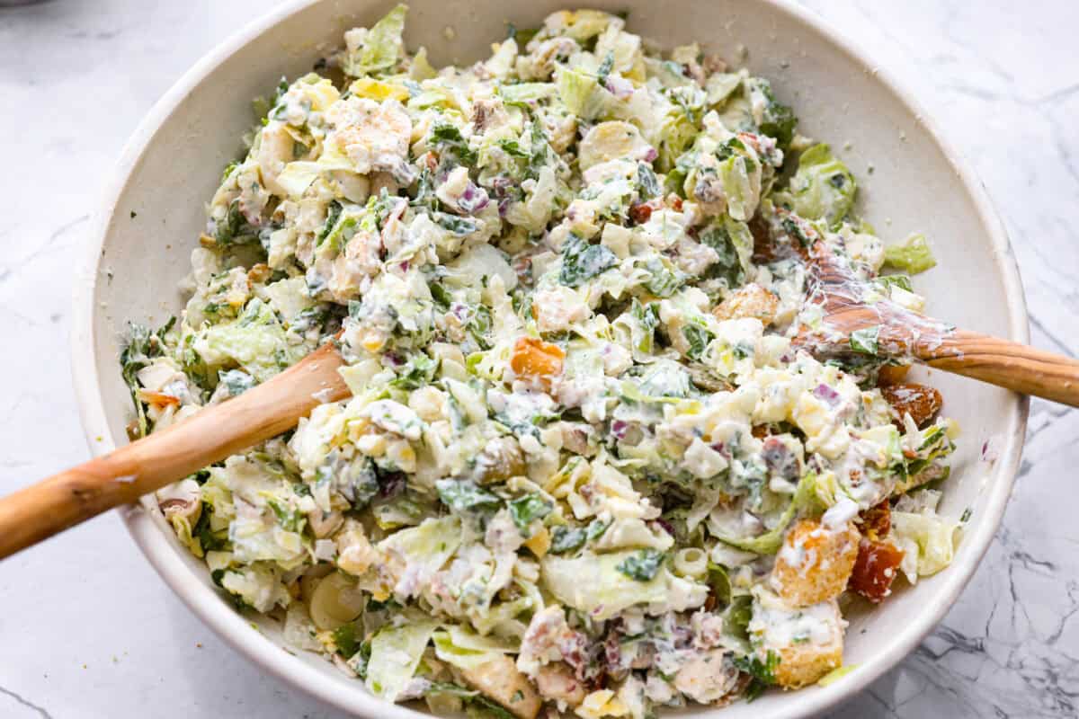 Chopped salad ingredients mixed with the dressing. 