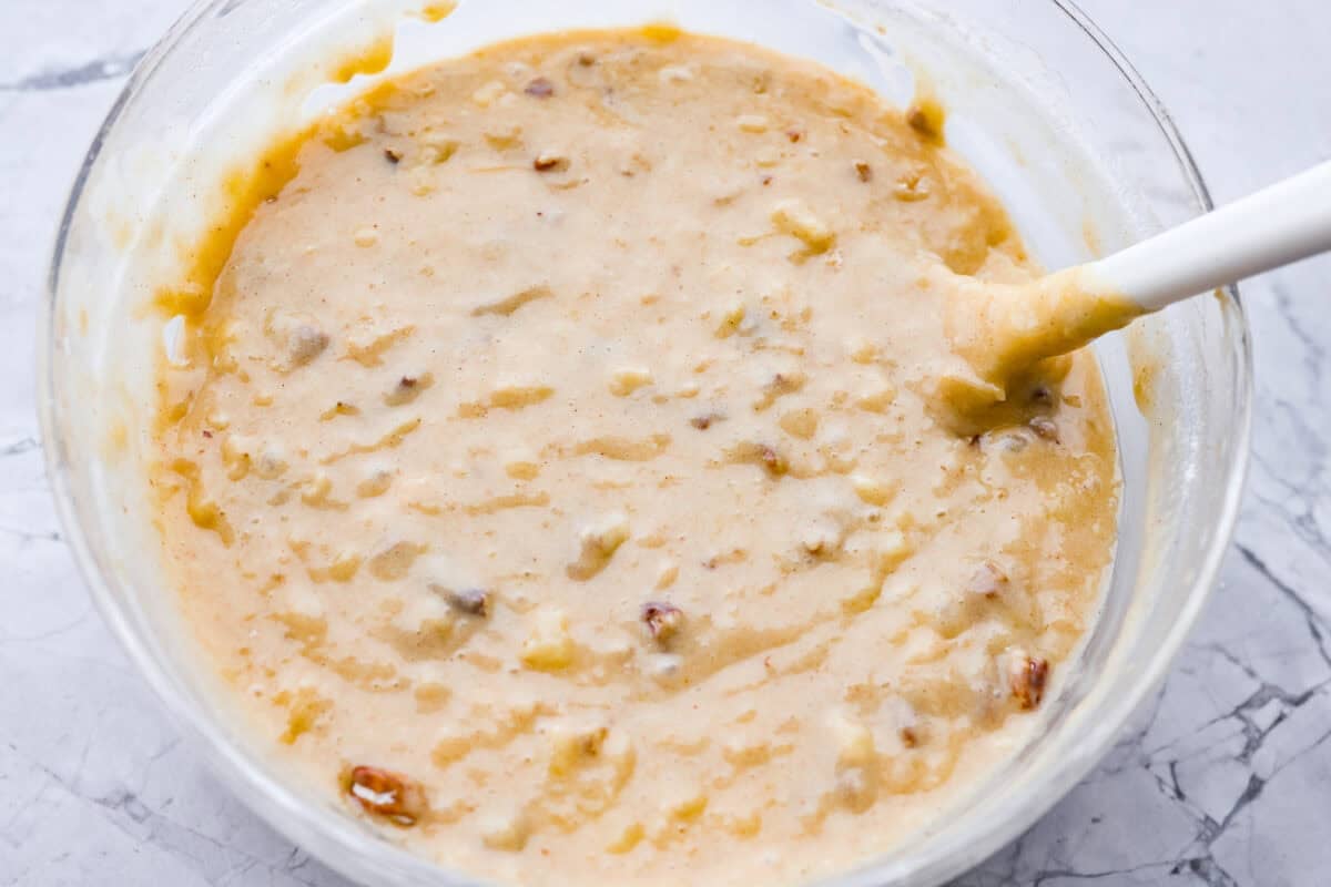 Wet and dry ingredients combined with pecans added in. 
