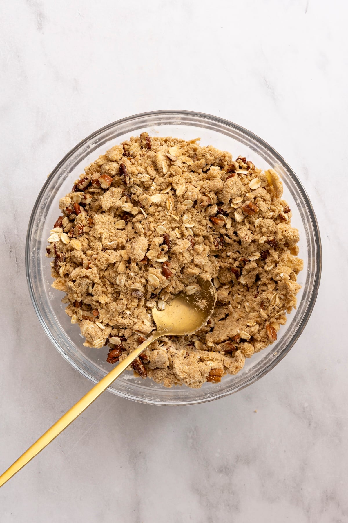 medium bowl with pecans mixed with flour/oat/brown sugar mix