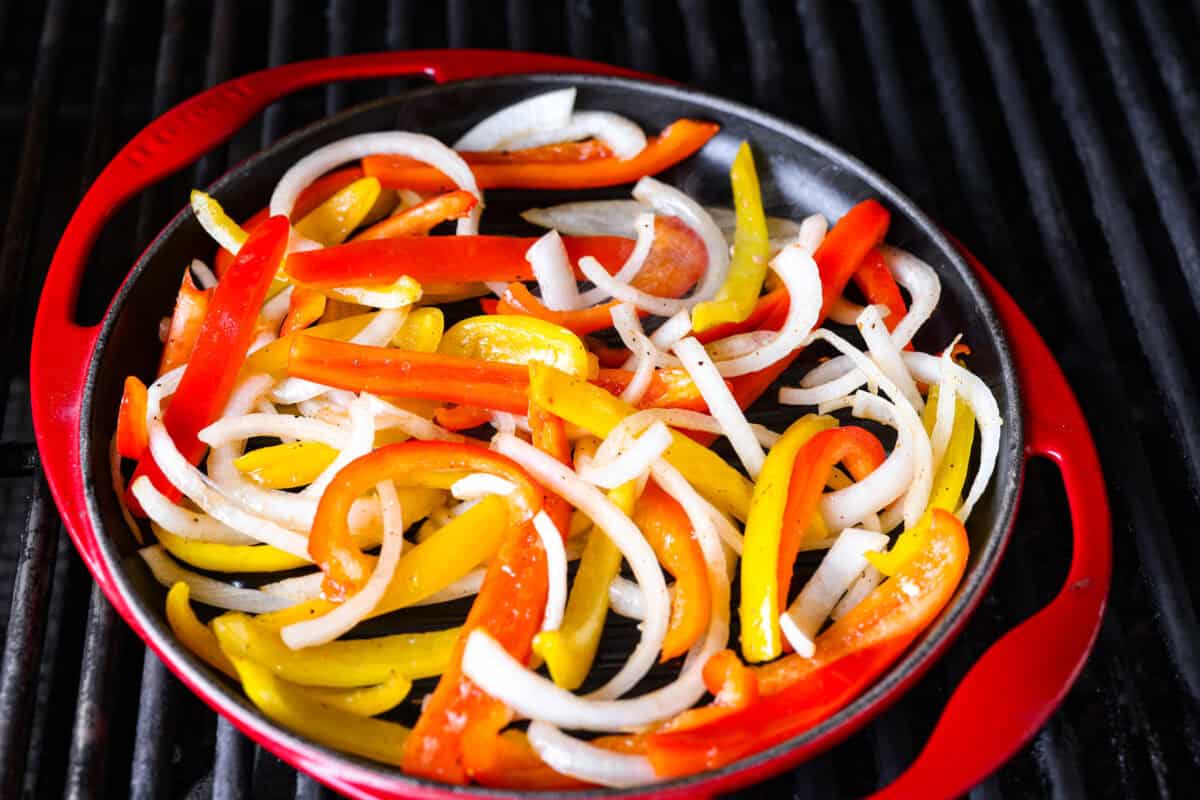 Veggies in a grill pan on the grill. 