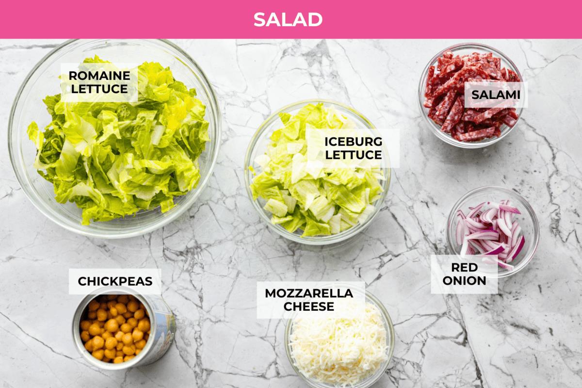 Overhead shot of labeled la scala salad ingredients.