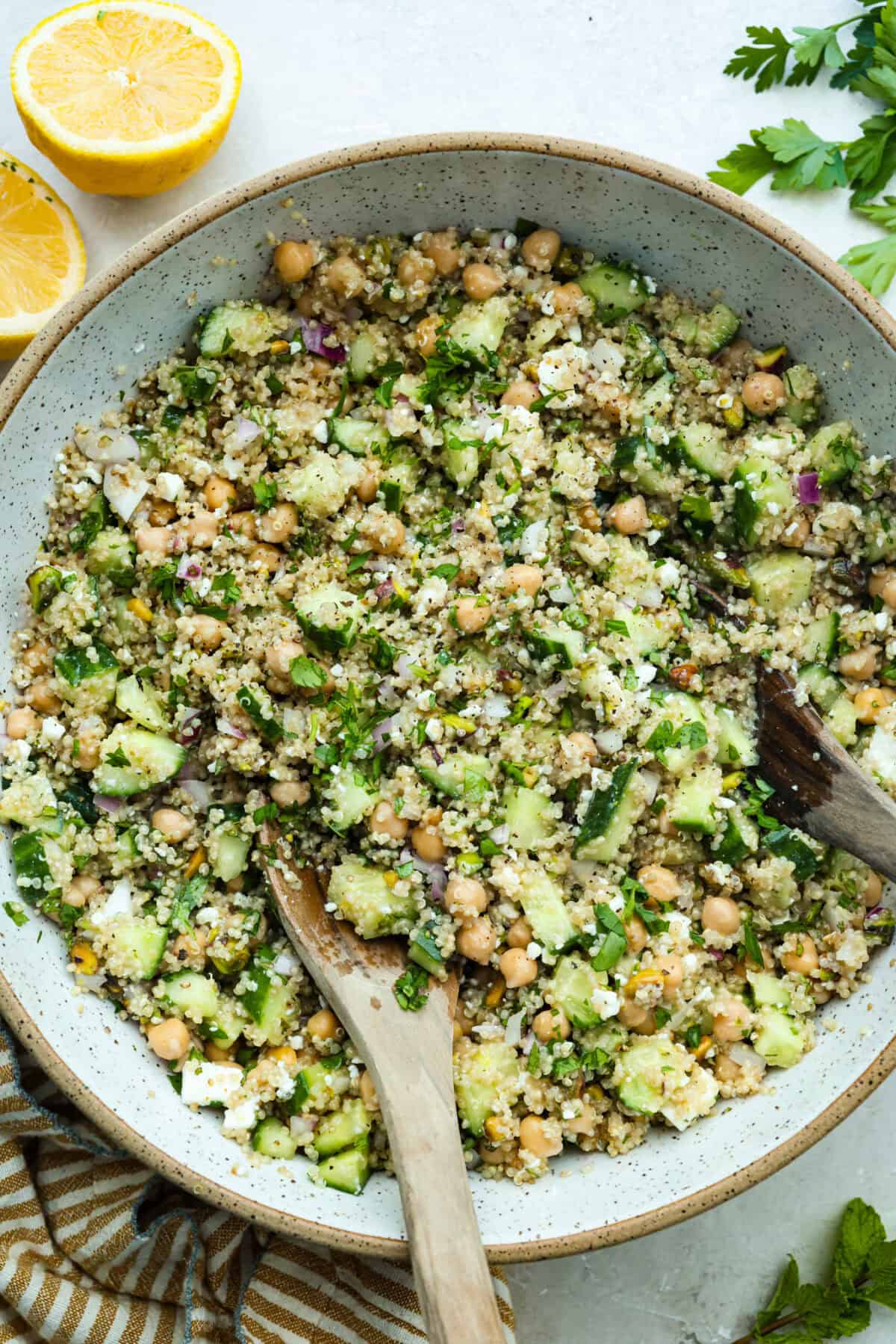 Large bowl of Jennifer Aniston salad with wooden serving spoon. 