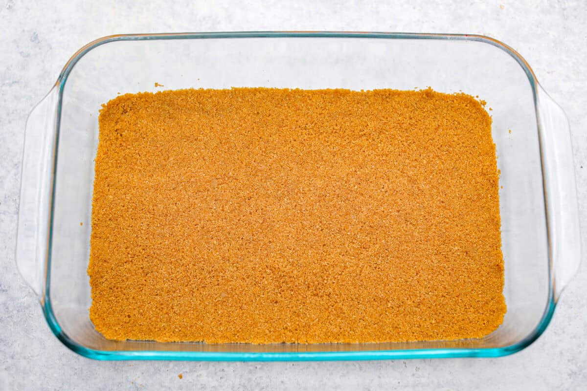 Graham cracker crust layer smashed into the bottom of the 9x13 dish. 
